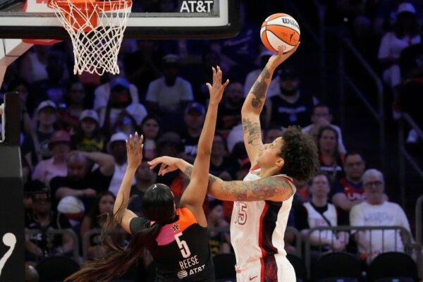 Brittney Griner of the U.S. Olympic team shoots over Team WNBA's Angel Reese during the WNBA All-Star Game in Phoenix on July 20, 2024. (Ross D. Franklin/AP Photo)