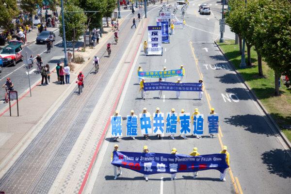 Falun Gong practitioners march along Embarcadero in San Francisco on July 20, 2024. (Lear Zhou/The Epoch Times)