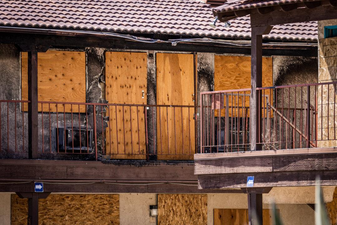 Homeless people live in the abandoned Lancaster Inn in Lancaster, Calif., on July 10, 2024. (John Fredricks/The Epoch Times)