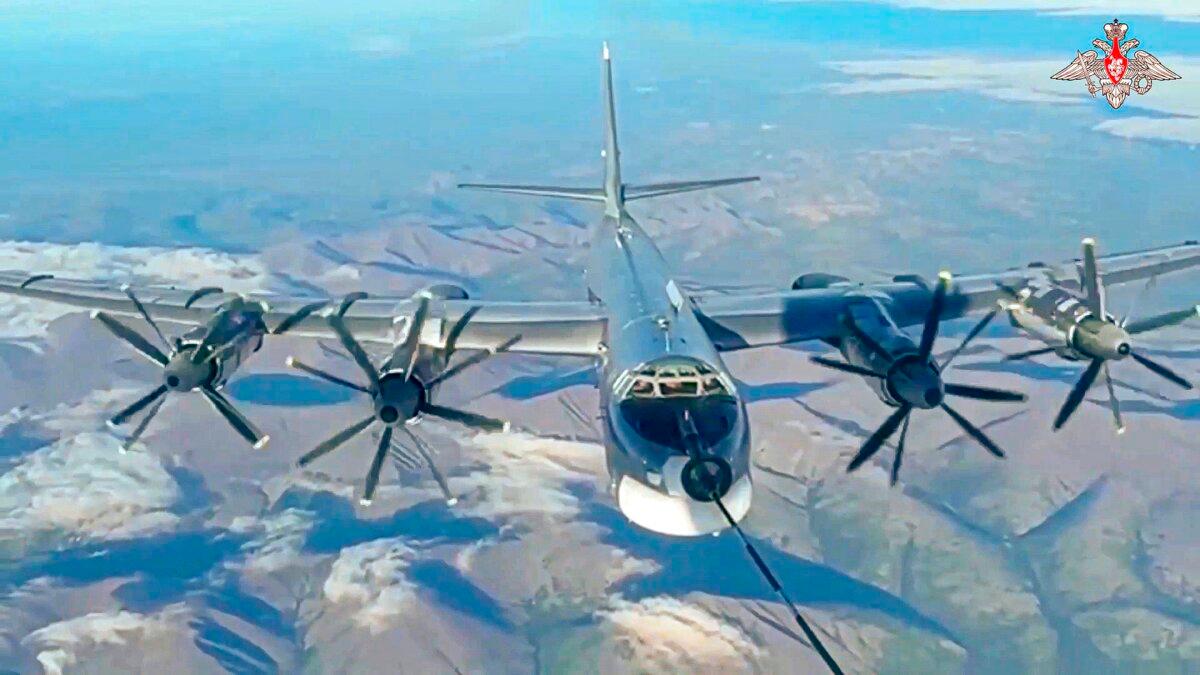 A Tu-95 strategic bomber of the Russian air force is refueled in the air during a joint Russia–China air patrol in a still from video footage released on July 25, 2024. (Russian Defense Ministry Press Service via AP)