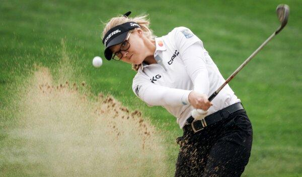 Canadian Brooke Henderson hits out of the sand on the first hole during the opening round of the CPKC Women's Open golf tournament in Calgary, Canada, on July 25, 2024. (Jeff McIntosh/The Canadian Press via AP)