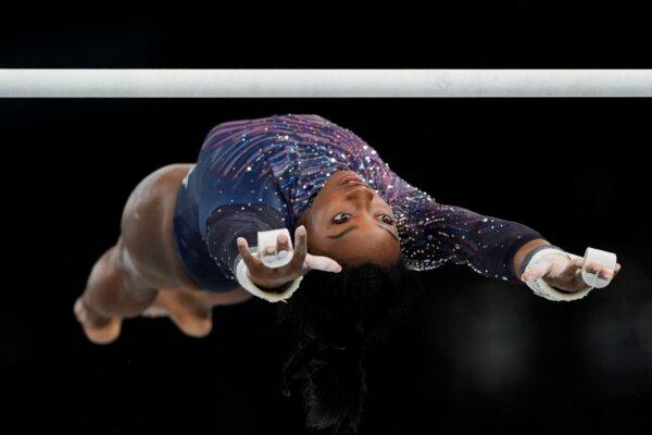 Simone Biles of the United States practices on the uneven bars during a gymnastics training session for the 2024 Summer Olympics in Paris on July 25, 2024. (Francisco Seco/AP Photo)