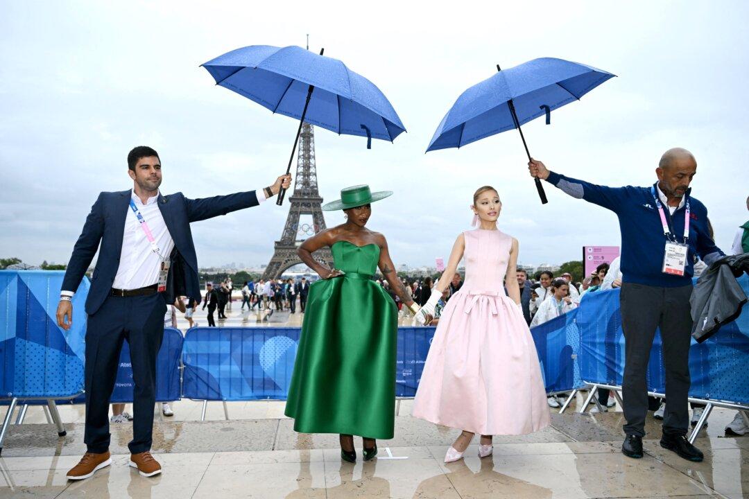 British actress and singer Cynthia Erivo (center L) and US singer Ariana Grande (center R) arrive ahead of the opening ceremony of the Paris 2024 Olympic Games in Paris on July 26, 2024. (Jonathan Nackstrand/AFP via Getty Images)