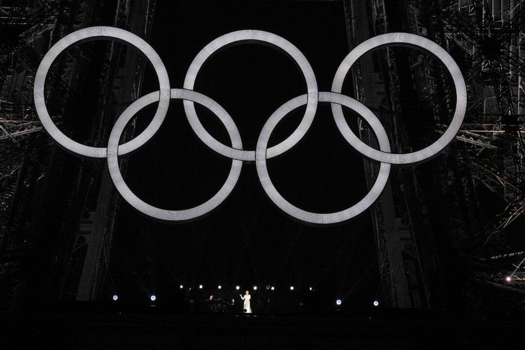 Canadian singer Celine Dion performs on the Eiffel Tower during the opening ceremony of the Paris 2024 Olympic Games in Paris, France, on July 26, 2024. (Xu Chang-Pool/Getty Images)