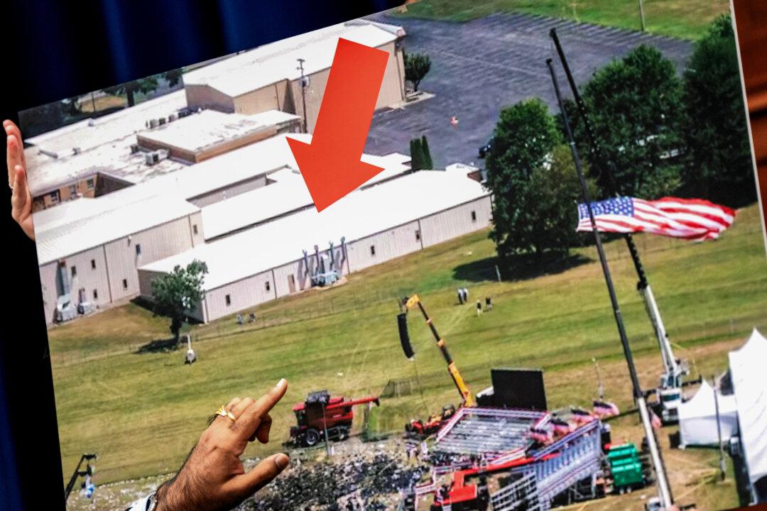 A photo of the building from which Thomas Matthew Crooks fired on former President Donald Trump is presented before the House Oversight and Accountability Committee during a hearing in Washington on July 22, 2024. (Kent Nishimura/Getty Images)