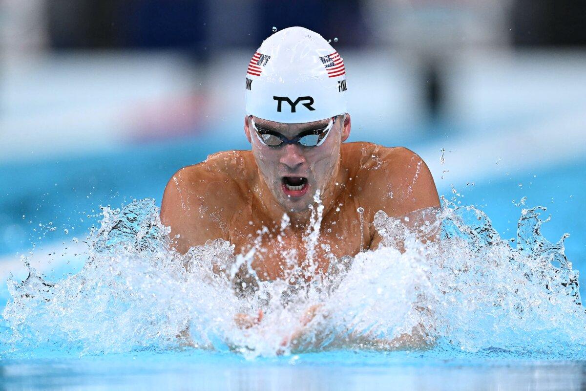 Team USA’s Nic Fink competes in a heat of the men's 100m breaststroke swimming event at the Paris 2024 Olympic Games at the Paris La Defense Arena in Nanterre, west of Paris, on July 27, 2024. (Jonathan Nackstrand / AFP via Getty Images)