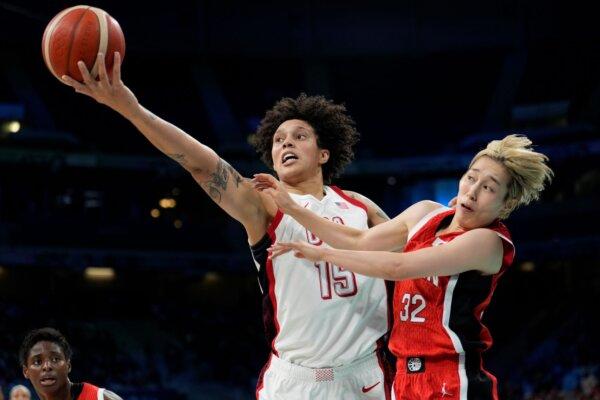 Brittney Griner of Team USA shoots over Japan's Saori Miyazaki in a women's basketball opener at the Summer Olympics in Villeneuve-d'Ascq, France, on July 29, 2024. (Mark J. Terrill/AP Photo)