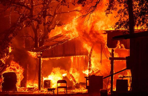 A property is seen in flames as the Park fire continues to burn near Paynes Creek in unincorporated Tehama County, Calif., on July 26, 2024. (Josh Edelson/AFP via Getty Images)