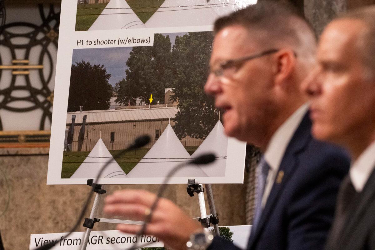 US Secret Service Acting Director Ronald Rowe, Jr. (2nd R), and FBI Deputy Director Paul Abbate show a photo of the shooter's position as they testify during a US Senate Homeland Security and Governmental Affairs and Senate Judiciary joint committee hearing on the security failures leading to the assassination attempt on former US President Donald Trump, at the US Capitol on July 30, 2024. (Roberto Schmidt/AFP via Getty Images)