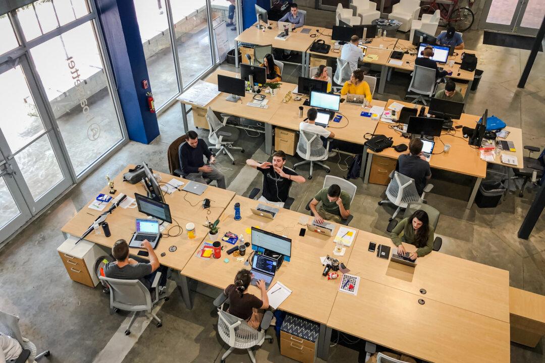 Staff at work in the Boatsetter office, a boat-renting tech company in Fort Lauderdale, Fla., on Aug. 7, 2019. Women are 26 percent more likely than men to seek out remote jobs, according to a 2021 study. (Gianrigo Marletta/AFP via Getty Images)