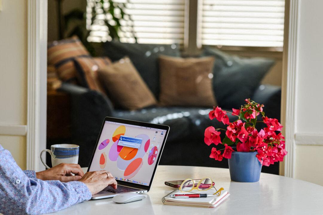 A person working on a laptop remotely from a home office in Los Angeles on Aug. 14, 2021. (Chris Delmas/AFP via Getty Images)