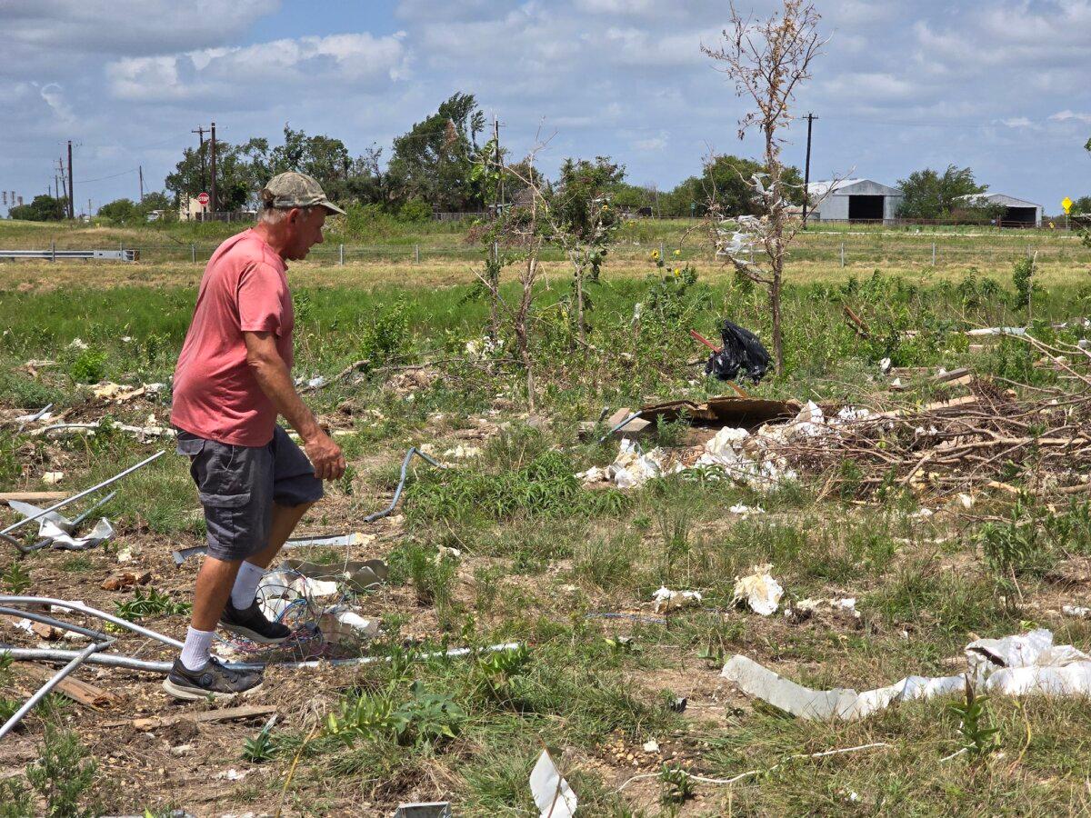 Paul Sperry, 59, walks through a trail of debris from an EF-3 tornado that ripped through Valley View, Texas, on May 25, 2024, killing seven people and injuring dozens. Photo taken on July 29, 2024. (Allan Stein/The Epoch Times)