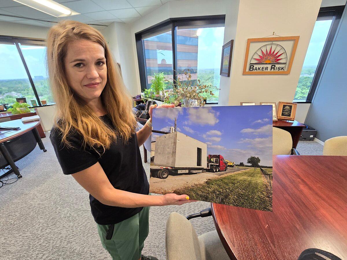 Karen Vilas, president of Fortress Protective Buildings in Houston, displays the company's newest storm shelter on July 30, 2024. (Allan Stein/The Epoch Times)