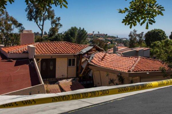 Collapsed homes slide down a hill along a street in the Rolling Hills States neighborhood in Rancho Palos Verdes, Calif., on July 10, 2023. (Apu Gomes/AFP via Getty Images)