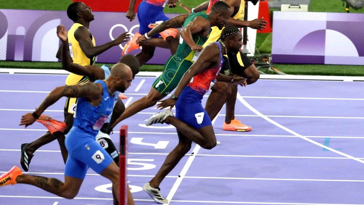 (Front to back) Italy's Lamont Marcell Jacobs, Botswana's Letsile Tebogo, USA's Noah Lyles, Jamaica's Oblique Seville, South Africa's Akani Simbine, Jamaica's Kishane Thompson, USA's Fred Kerley, and USA's Kenneth Bednarek compete in the men's 100-meter final at the Paris Olympics on Aug. 4, 2024. (Dimitar Dilkoff/AFP via Getty Images)