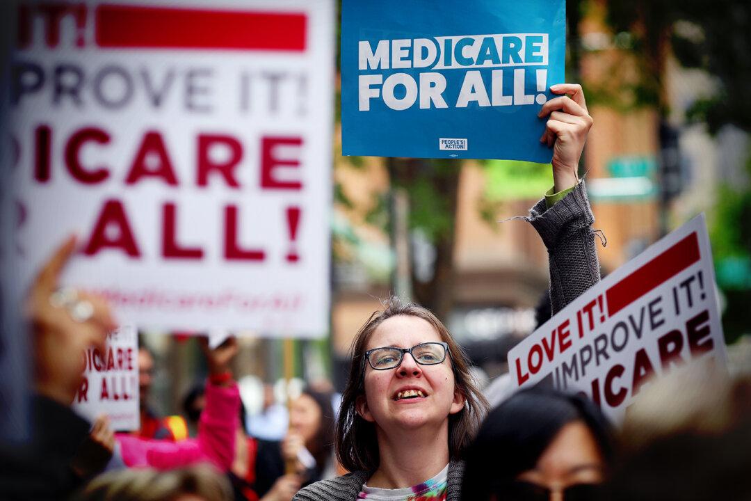 Protesters supporting Medicare for All hold a rally outside Pharmaceutical Research and Manufacturers of America headquarters in Washington on April 29, 2019. (Win McNamee/Getty Images)