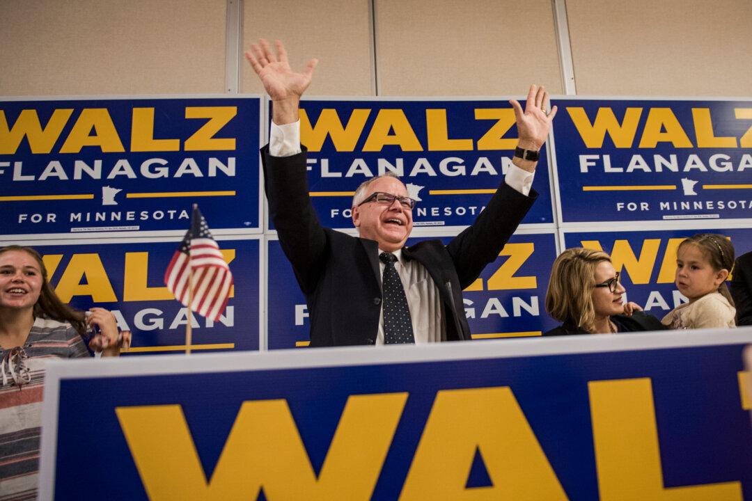 Rep. Tim Walz (D-Minn.) takes the stage in front of a crowd of supporters at his election night party in St Paul, Minn., on Aug. 14, 2018. (Stephen Maturen/Getty Images)