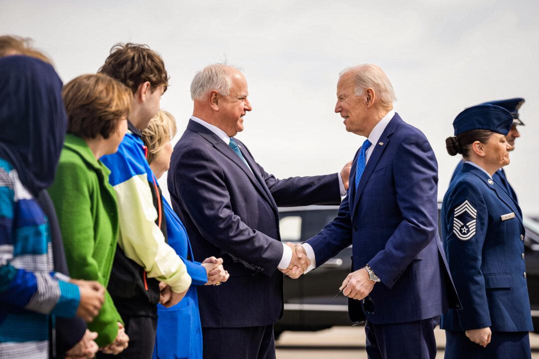 President Joe Biden greets Minnesota Gov. Tim Walz at Minneapolis-Saint Paul Joint Air Reserve Station on April 3, 2023. (Official White House Photo by Cameron Smith)