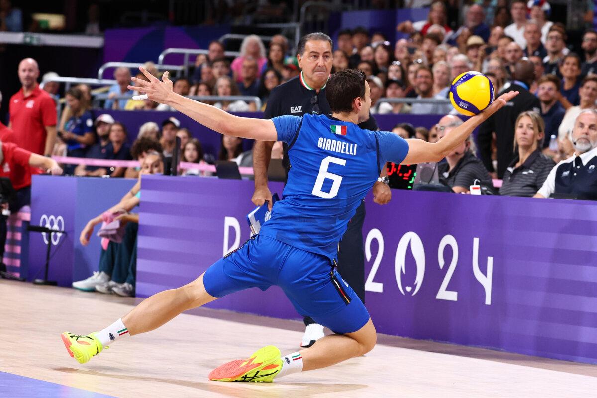 Simone Giannelli of Team Italy dives for a ball during a men's bronze medal match between Team Italy and Team United States on day 14 of the Olympic Games at Paris Arena in Paris on Aug. 9, 2024. (Buda Mendes/Getty Images)