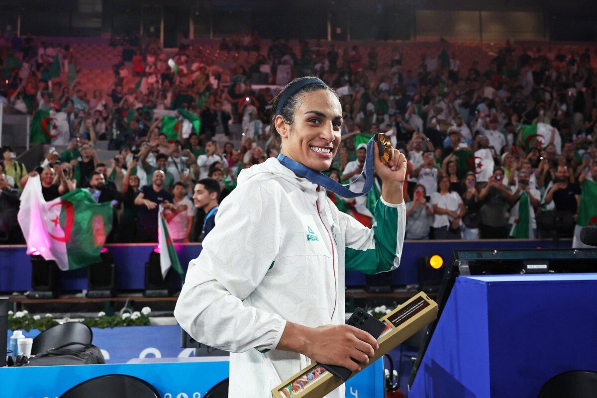 Gold medallist Imane Khelif of Team Algeria celebrates with her medal after the Boxing Women's 66 kg medal ceremony on day 14 of the Olympic Games at Roland Garros in Paris on Aug. 9, 2024. (Richard Pelham/Getty Images)