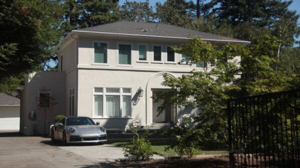 An Atherton house with a Porsche 911 in front of it on Aug. 8, 2024. (Dylan Morgan/The Epoch Times)