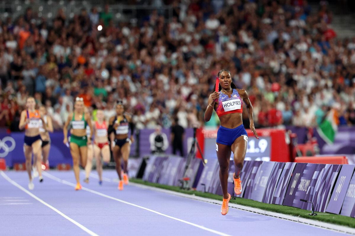 Alexis Holmes of Team United States celebrates winning the gold medal in the women's 4x400-meter relay final on day 15 of the Olympic Games at Stade de France in Paris on Aug. 10, 2024. (Hannah Peters/Getty Images)