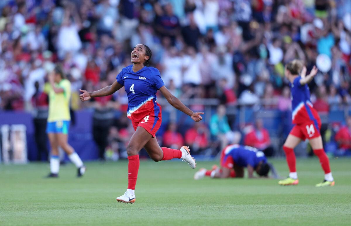 Naomi Girma (4) of Team United States celebrates victory in the women's gold medal match between Brazil and USA  during the Olympic Games at Parc des Princes in Paris on Aug. 10, 2024. (Justin Setterfield/Getty Images)