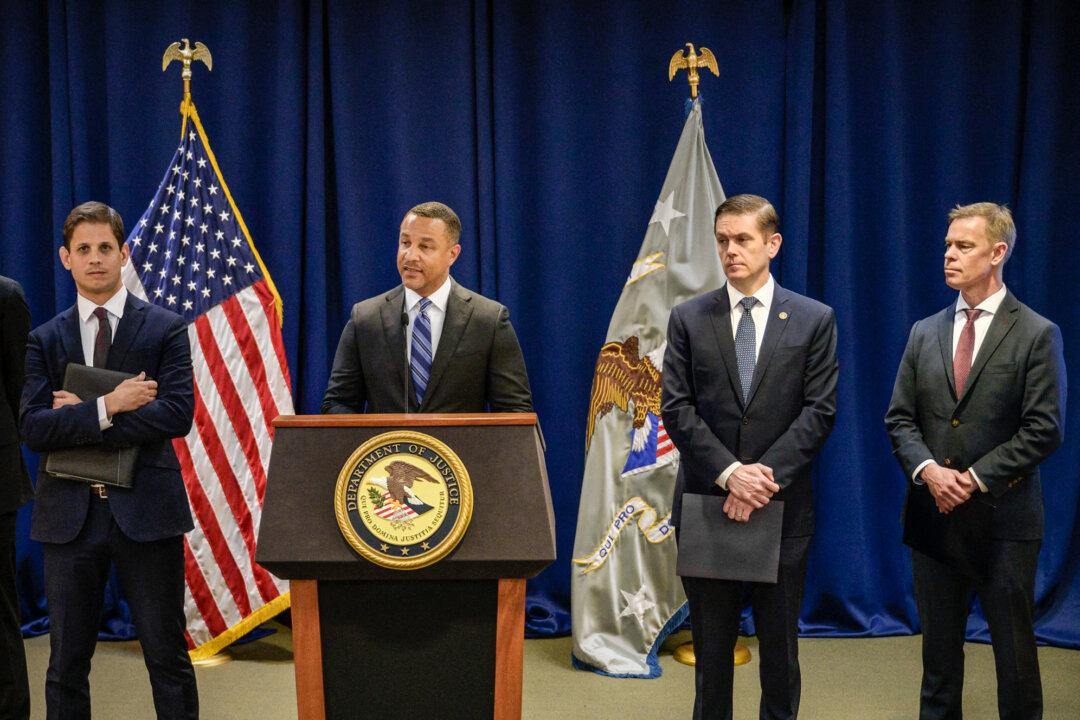 Officials attend a press conference held by the Department of Justice to announce the arrest and charges of multiple individuals alleged to be working with the Chinese regime, at the U.S. Attorney's office in New York City on April 17, 2023. (Angela Weiss/AFP via Getty Images)