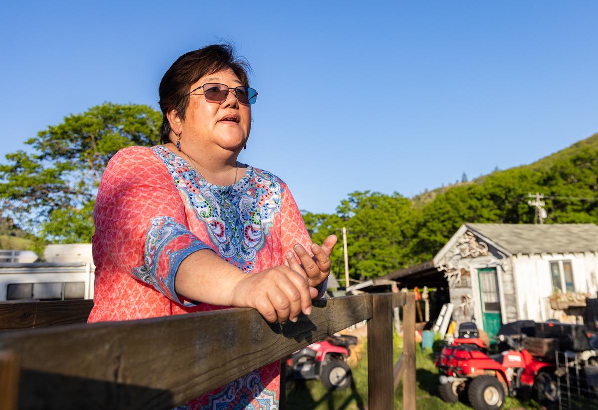 Copco Lake resident Chrissie Reynolds fears increased wildfire risks could threaten her home and her family’s once-lakefront cabins on the near the Klamath River. (John Fredricks/The Epoch Times)