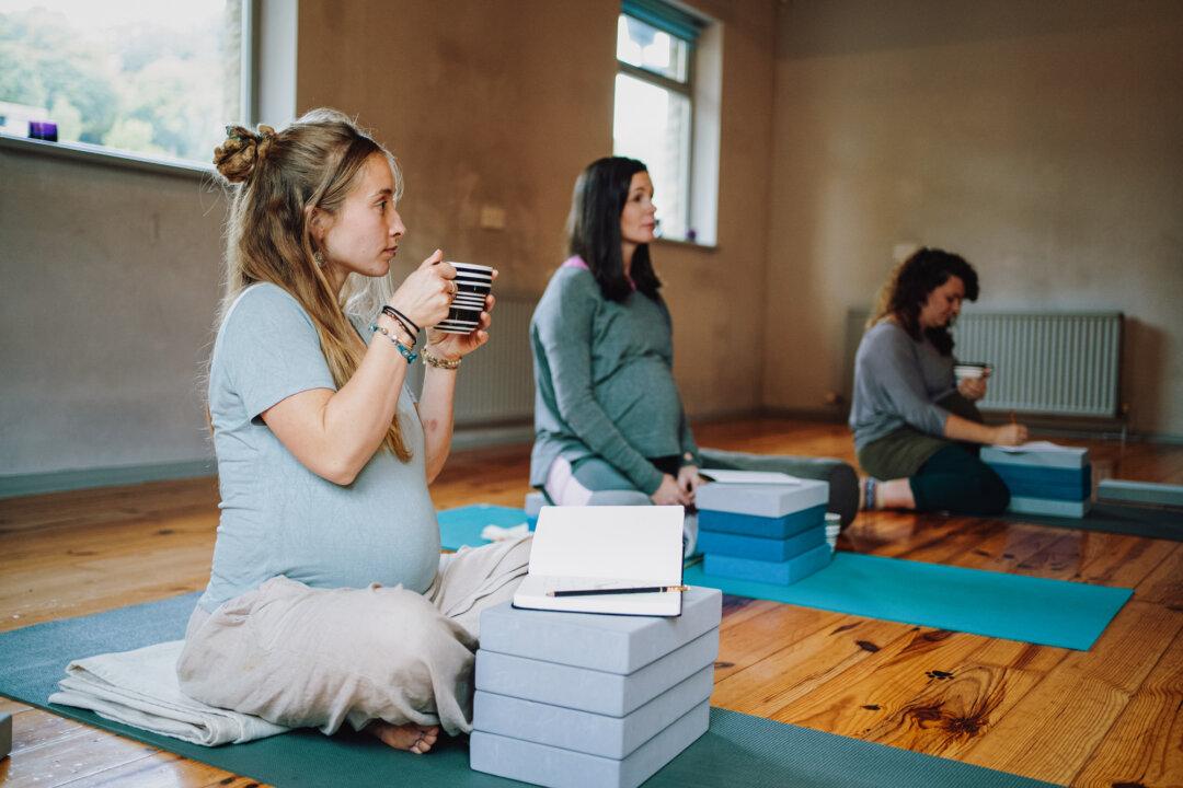 Pregnant women sit on yoga mats during a birth preparation workshop. T. gondii passed onto an unborn baby from the mother result in the most “acute and fatal” consequences. (Sarah Mason/Gettyimages)