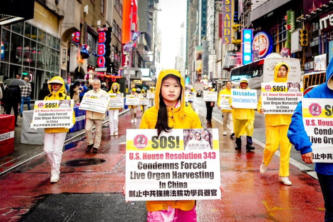 Falun Gong practitioners take part in a parade to celebrate World Falun Dafa Day and call for an end to the persecution in China, in New York City on May 10, 2024. (Samira Bouaou/The Epoch Times)