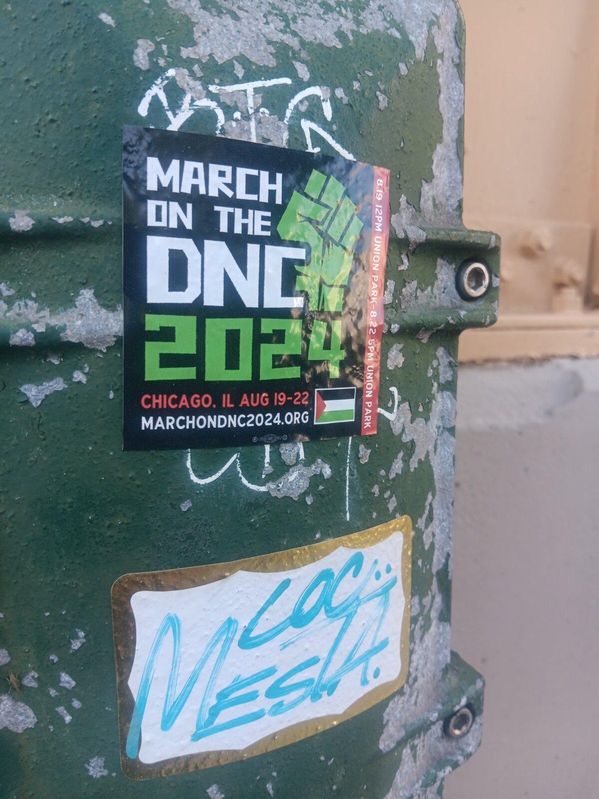 A sticker advertises a protest against the Democratic National Convention on Aug. 16, 2024, in Chicago, near the United Center and Union Park, where demonstrations are expected. (Nathan Worcester/The Epoch Times)