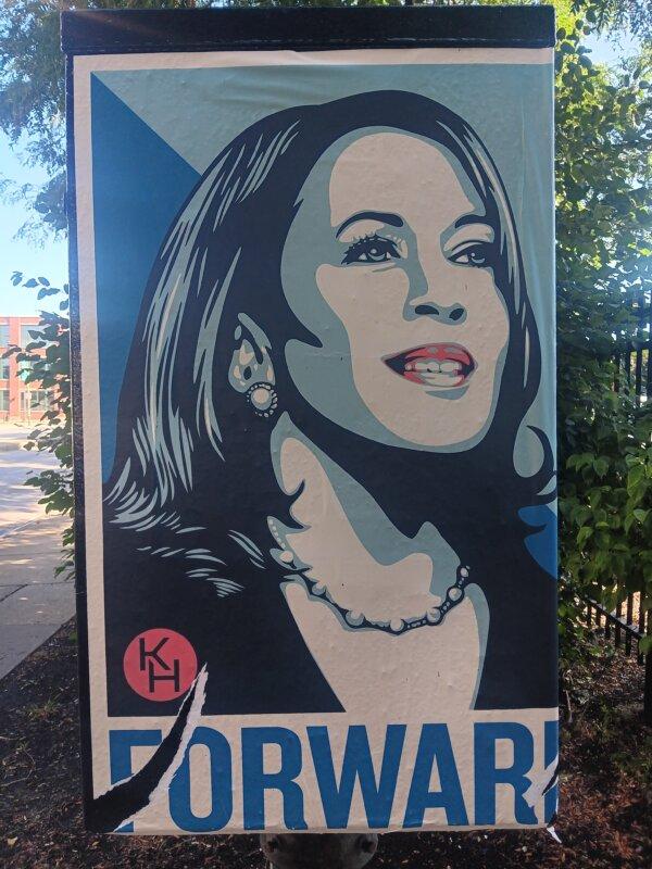 Pro-Kamala Harris signage featuring art from Shepard Fairey, the designer of the Barack Obama "Hope" poster, near Union Park in Chicago on Aug. 16, 2024. (Nathan Worcester/The Epoch Times)