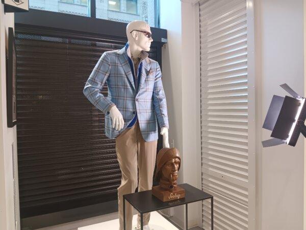 A well-protected mannequin at the high-end clothing retailer Syd Jerome in downtown Chicago on Aug. 16, 2024. The storefront is protected ahead of the Democratic National Convention the following week, which will be marked by protests. (Nathan Worcester/The Epoch Times)