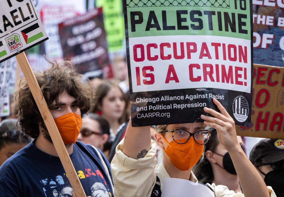 Pro-Palestine protestors march near the 2024 DNC grounds in Chicago, Ill., on Aug. 19, 2024. (John Fredricks/The Epoch Times)