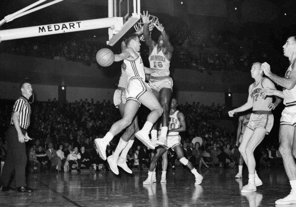 Al Attles of the then-San Francisco Warriors defends against the then-St. Louis Hawks' Cliff Hagan during a game in St. Louis on Jan. 6, 1963. (Fred Waters/AP Photo)