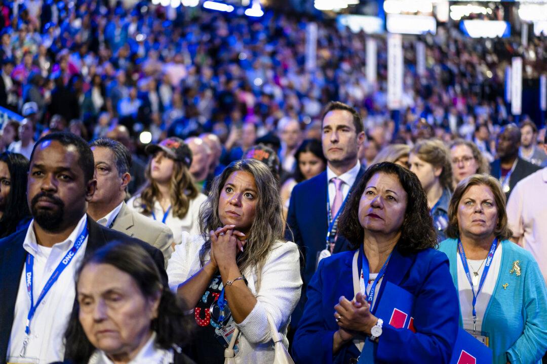 Delegates listen to Jonathan Polin and Rachel Goldbergís story about their son Hersh Goldberg-Polin held hostage in Gaza during the Democratic National Convention in Chicago on Aug. 21, 2024. (Madalina Vasiliu/The Epoch Times)