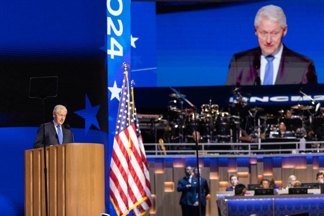 Former President Bill Clinton speaks at the 2024 DNC in Chicago on Aug. 21, 2024. (John Fredricks/The Epoch Times)