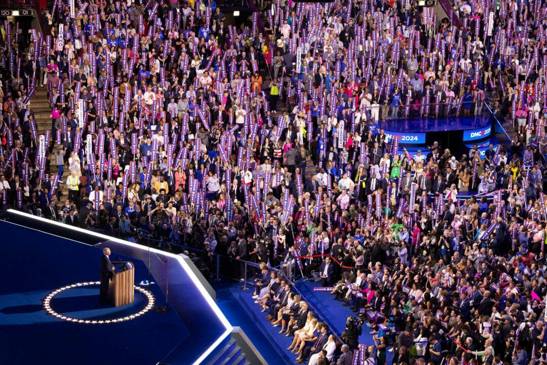 Vice Presidential nominee Tim Walz speaks to supporters at the 2024 DNC in Chicago on Aug. 21, 2024. (John Fredricks/The Epoch Times)