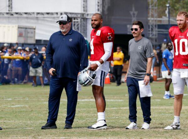 Head coach Mike McCarthy of the Dallas Cowboys and quarterback Dak Prescott (4) look on during a joint practice with the Los Angeles Rams at training camp in Oxnard, Calif., on Aug. 8, 2024. (Kevork Djansezian/Getty Images)