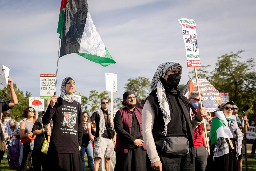 People protest for a Gaza ceasefire during the 2024 DNC held in Chicago on Aug. 22, 2024. (John Fredricks/The Epoch Times)