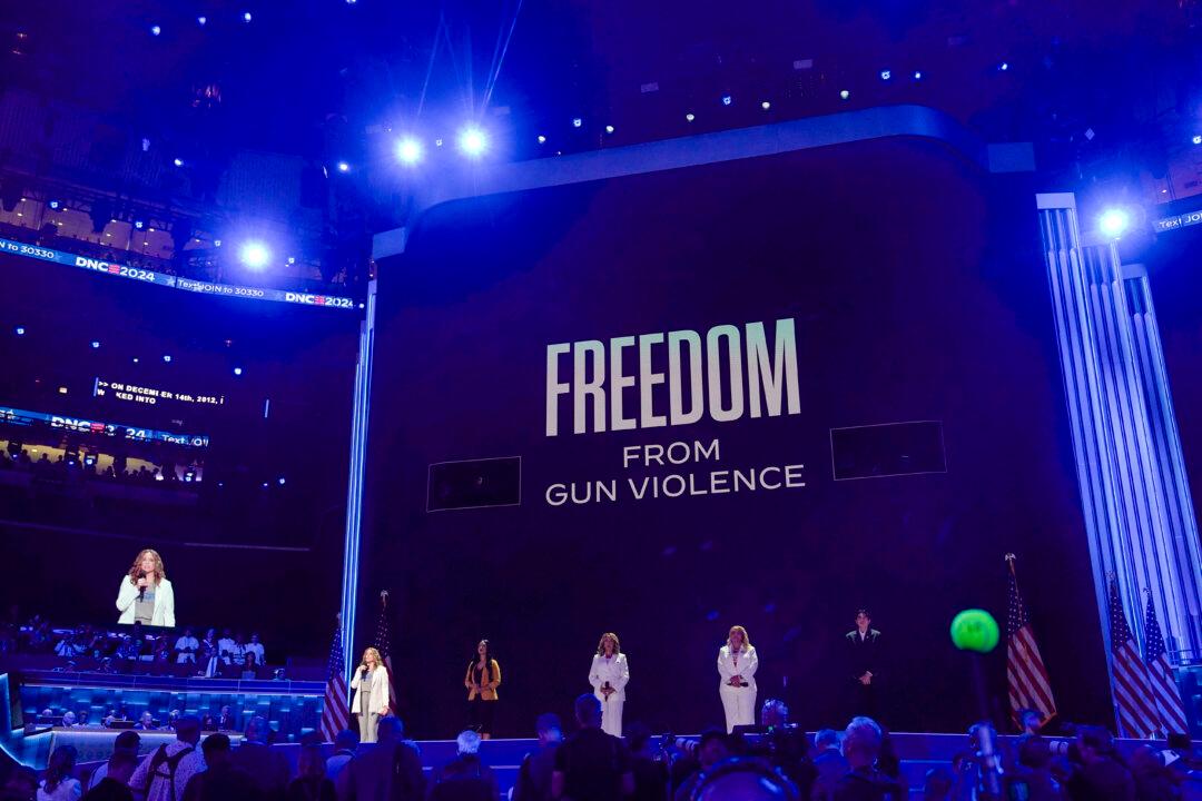 Rep. Lucy McBath (C), Democrat from Georgia, speaks about gun violence alongside people who were affected by gun violence, L-R, Abbey Clements, Kim Rubio, Melody McFadden and Edgar Vilchez during the last day of the Democratic National Convention in Chicago on Aug. 22, 2024. (Madalina Vasiliu/The Epoch Times)