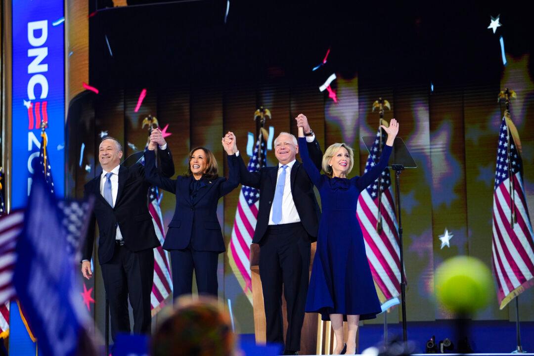 (L-R) Second Gentleman Douglas Emhoff, Vice President and Democratic presidential candidate Kamala Harris, Minnesota Governor and Democratic vice presidential candidate Tim Walz and Gwen Walz on the last day of the Democratic National Convention, in Chicago on Aug. 22, 2024. (Madalina Vasiliu/The Epoch Times)