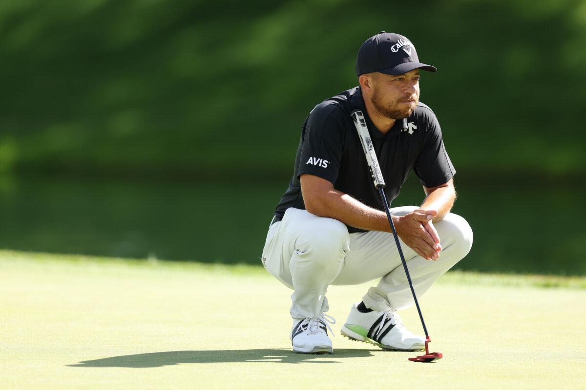 Xander Schauffele of the United States lines up a putt on the third green during the third round of the BMW Championship at Castle Pines Golf Club in Castle Rock, Colo., on Aug.t 24, 2024. (Christian Petersen/Getty Images)