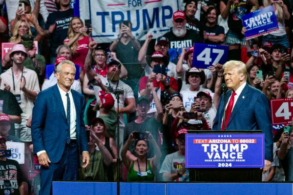 Former President Donald Trump (R) welcomes independent presidential candidate Robert F. Kennedy Jr. (L) to the stage during a campaign rally in Glendale, Ariz., on Aug. 23, 2024. (Olivier Touron/AFP via Getty Images)