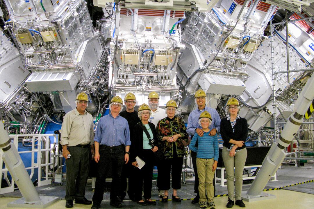 Staff pose for a photo at the heart of the National Ignition Facility at Lawrence Livermore National Laboratory in Livermore, Calif., in this file photo. (Steve Jurvetson/CC BY 2.0)