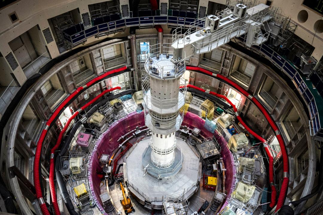 (Top) The Princeton Plasma Physics Laboratory's tokamak, called the National Spherical Torus Experiment-Upgrade (NSTX-U), in this file photo. (Bottom) The ITER tokamak machine in Saint-Paul-Lez-Durance, France, on Sept. 9, 2021. (Michael Livingston/PPPL Communications, Daniel Cole/AP Photo)