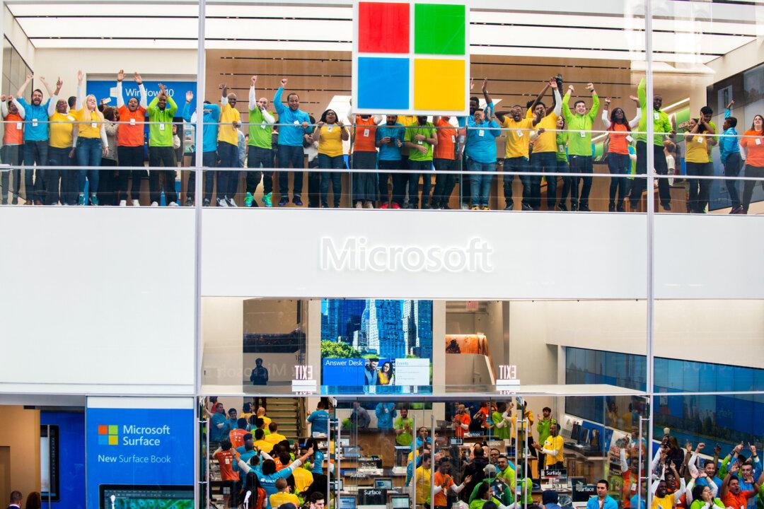 Employees celebrate the grand opening of Microsoft's first flagship store on Fifth Avenue in New York City on Oct. 26, 2015. (Bryan Thomas/Getty Images)