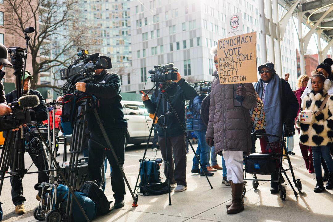 Members of the National Action Network protest outside the office of hedge fund billionaire, Bill Ackman, in New York City on Jan. 4, 2024. (Michael M. Santiago/Getty Images)