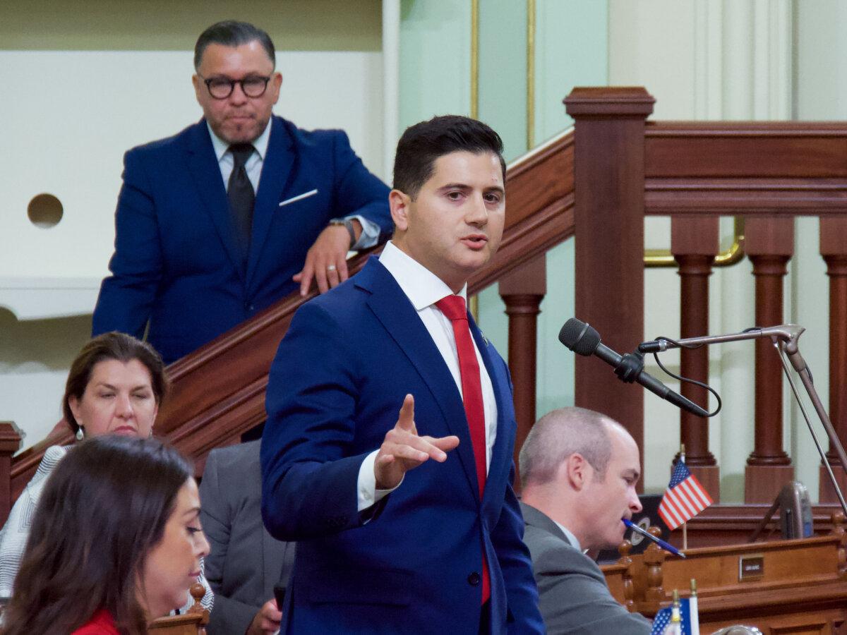 Assemblyman Bill Essayli addresses the Legislature on the floor of the Assembly at the Capitol in Sacramento, Calif., Aug. 31, 2024. (Travis Gillmore/The Epoch Times)